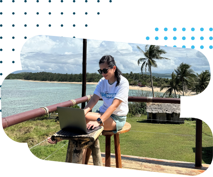 The Side Hustle Squad VA working with ocean view.